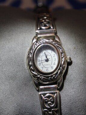 Watch, silver tone with brown adjustable band. Boca Classics brand. Used.